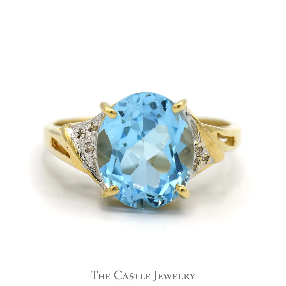 Oval Blue Topaz Ring with Diamond Accented Sides in 10k Yellow Gold